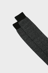 Close-up of the ribbed cuff on Bresciani Michele socks, in a black dark grey melange texture.