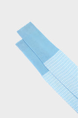 Close-up of the English cuff on Bresciani Remo socks, featuring a delicate sea and white sea breeze pattern.