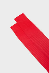 Close-up of the ribbed knit and cuff on Bresciani Cesare socks, highlighting the high cuff and the solid red color.