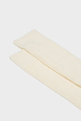 Close-up of the ribbed knit and hand-linked toe on Bresciani 'Lupo' socks, in a solid ivory color.