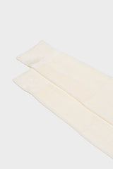 Close-up of the high cuff on Bresciani Celio socks, highlighting the single rib texture in a solid white color.