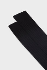 Close-up of the ribbed knit and hand-linked toe on Bresciani Valerio socks, in a solid black color.