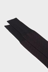 Close-up of the pindots pattern on the cuff of Bresciani Fabio socks, in a navy red color.
