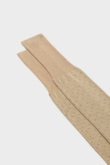Close-up of the pindots pattern on the cuff of Bresciani Fabio socks, in a tan color.
