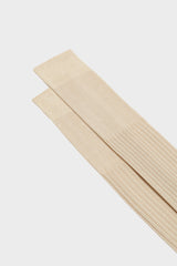 Close-up of the ribbed knit and cuff on Bresciani Cesare socks, highlighting the high cuff and the solid cream color.