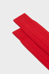 Close-up of the ribbed knit and hand-linked toe on Bresciani Massimo socks, in a solid red color.