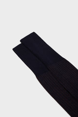 Close-up of the fine ribbed texture on the cuff of Bresciani Mario socks, in a blue brown color.