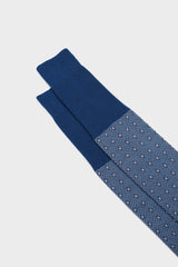 Close-up of the geometric micro-pattern and cuff on Bresciani Nicola socks, in a ocean color.